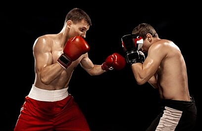 Two professional boxer boxing on black wall,